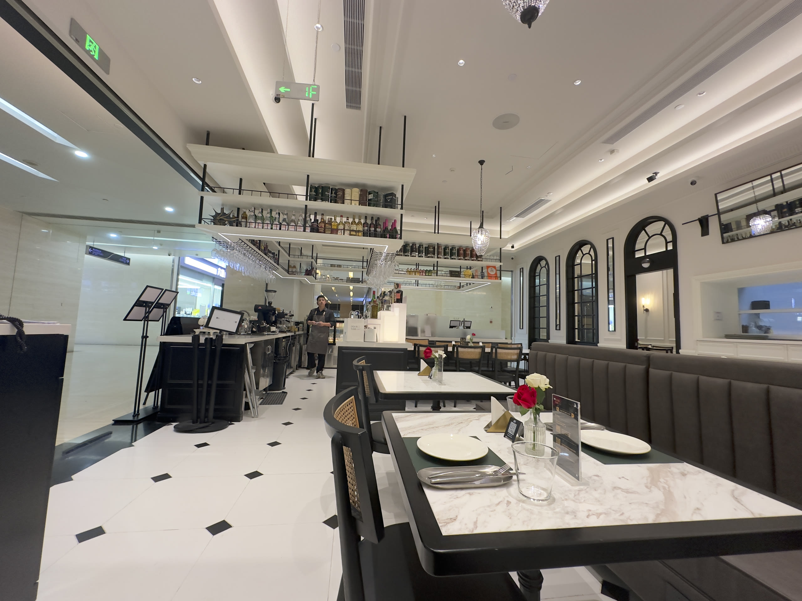 Elegant cafe-lounge interior with marble tables and bar