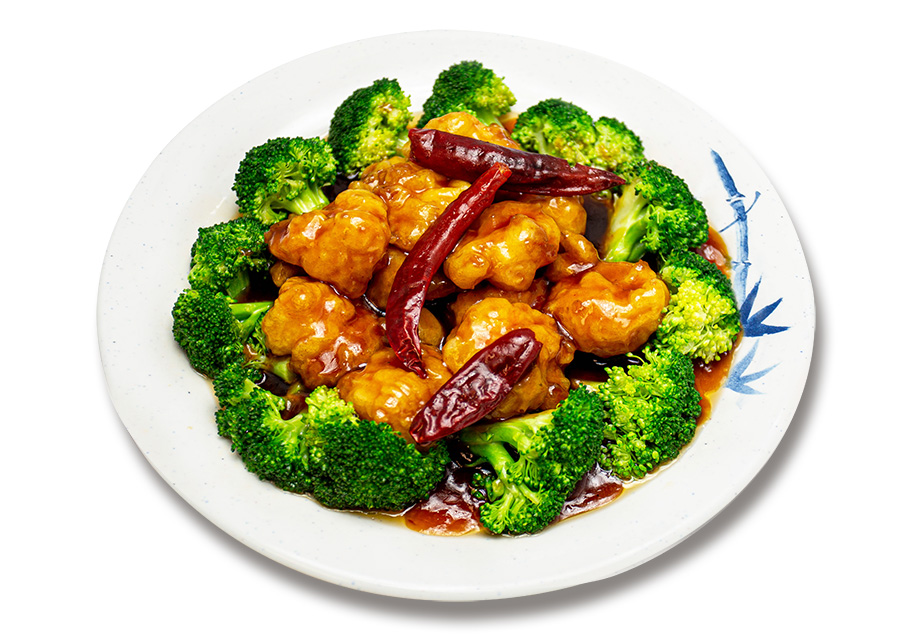 General Tso's chicken ringed with broccoli and dried chilies, studio shot