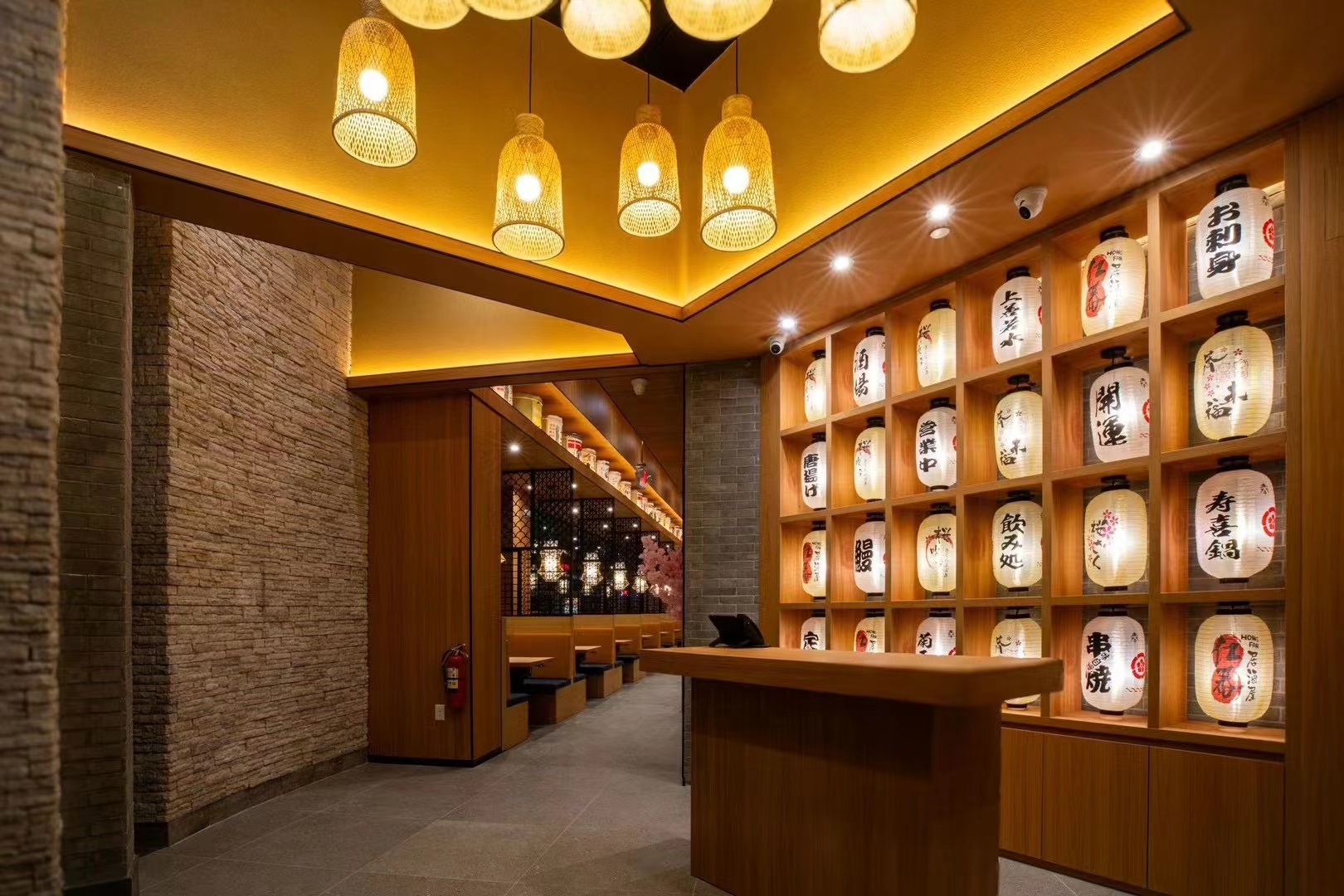 Built ramen restaurant entrance with a glowing wall of Japanese lanterns