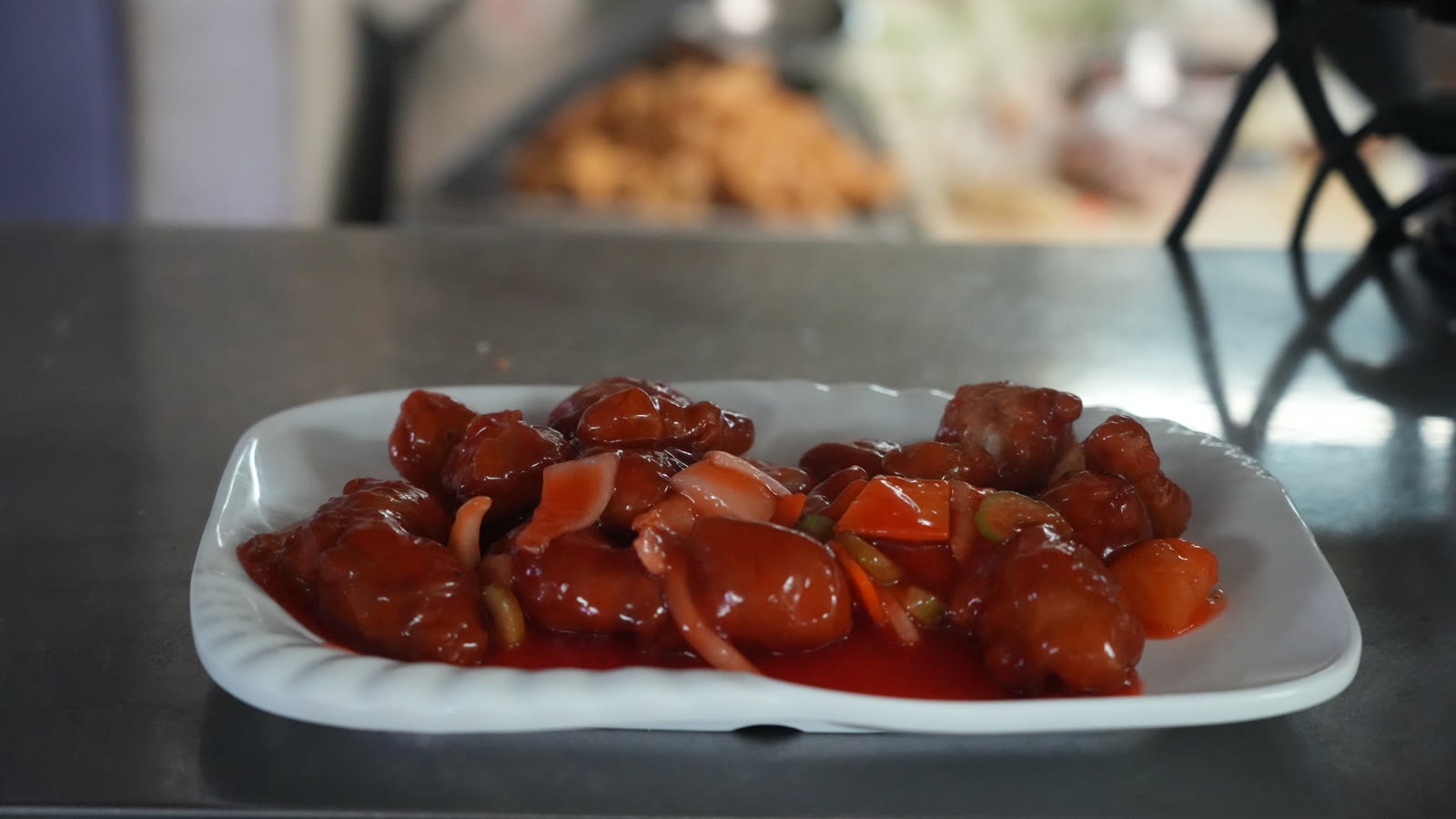 Glossy sweet-and-sour seafood dish closeup